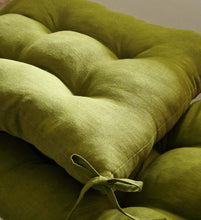 Load image into Gallery viewer, Olive green linen seat cushion with tufted design and corner ties for chairs or benches.